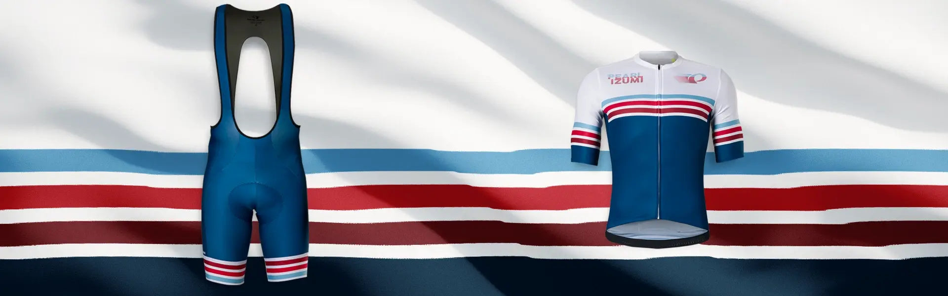 background banner for PEARL iZUMi limited edition kit for Americana Collection. Picture of navy bibs with red, white and blue stripes on left, and jersey with stripes on right